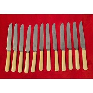 Lot of 12 Vintage Universal Resistain Bakelite Stainless Flatware Butter Cutlery